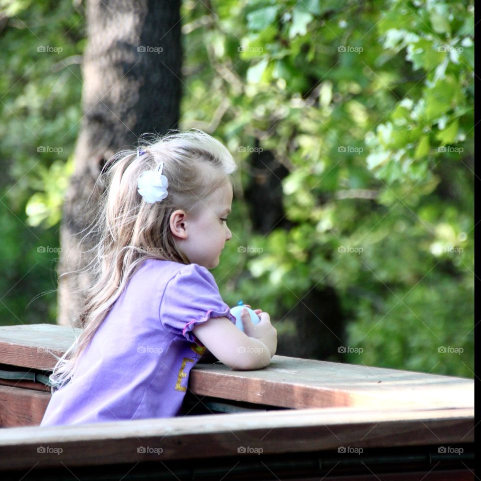 Girl Contemplating in the woods.