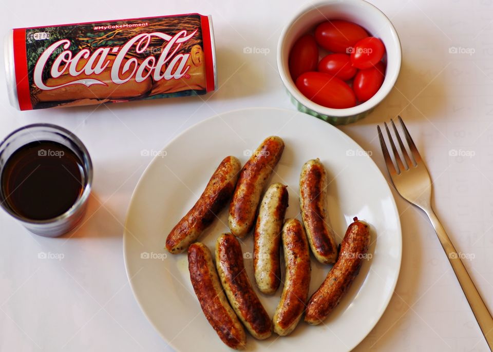 Coca Cola with sausages