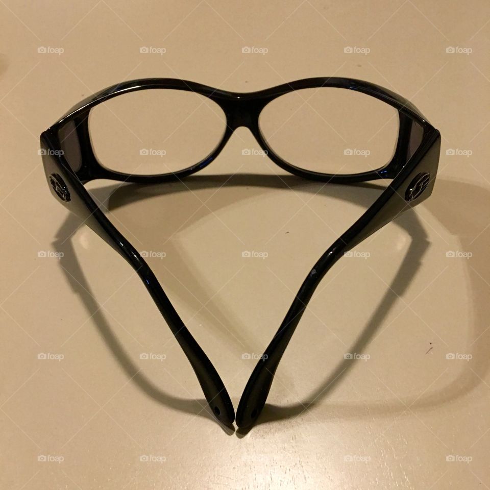 Black Framed Eyeglasses

I love my wrap glasses because they get dark in the sun & clear indoors.  Don't have to carry two pairs of prescription eyeglasses with me now!