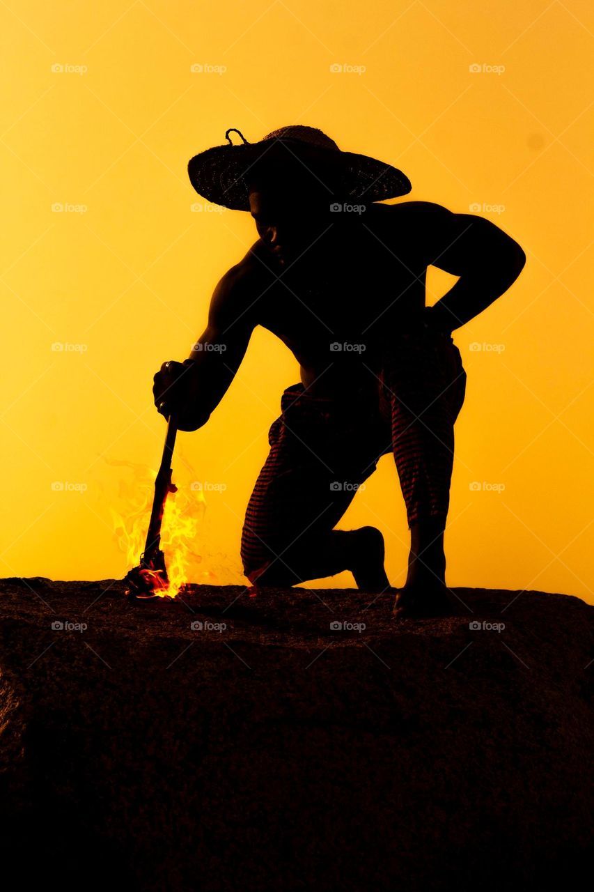 An inspiring silhouette with a glowing light at the edge, symbolizing hope and enlightenment. The image captures a powerful moment of strength and possibility, with a subtle connection to Africa’s vibrant spirit and potential.