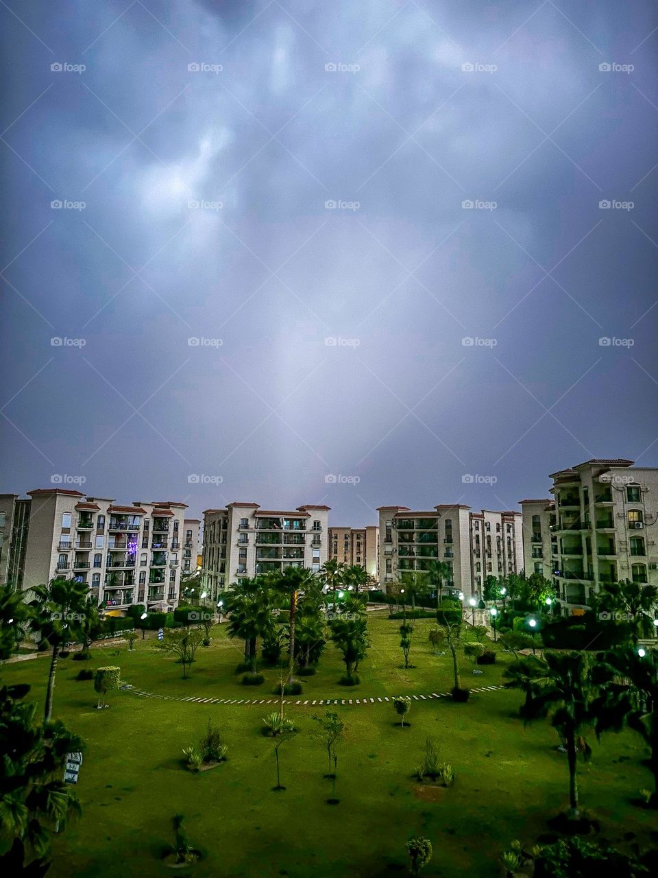 A thunderstorm lights up the sky over a residential compound in New Cairo