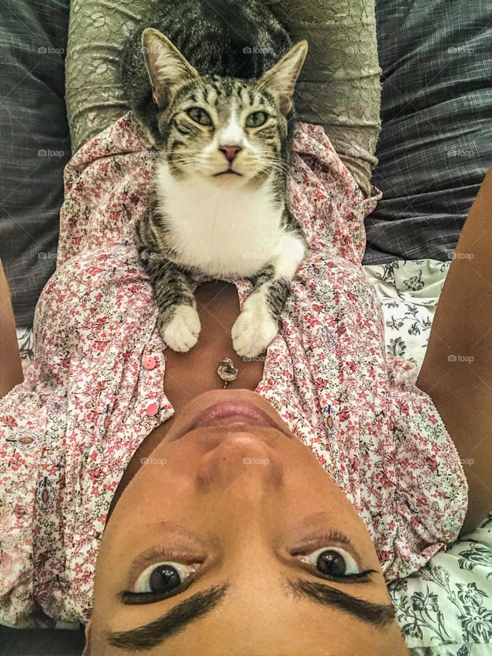 Woman taking a selfie of her and her cat