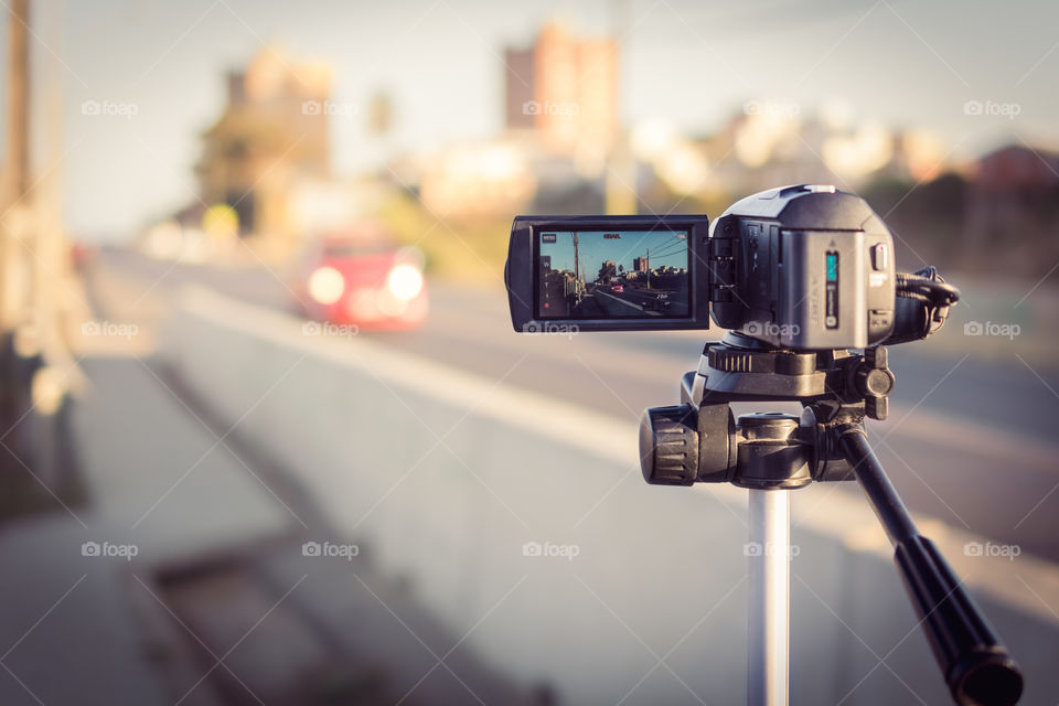 Camera recording the lifestyle of the city at the sunset 