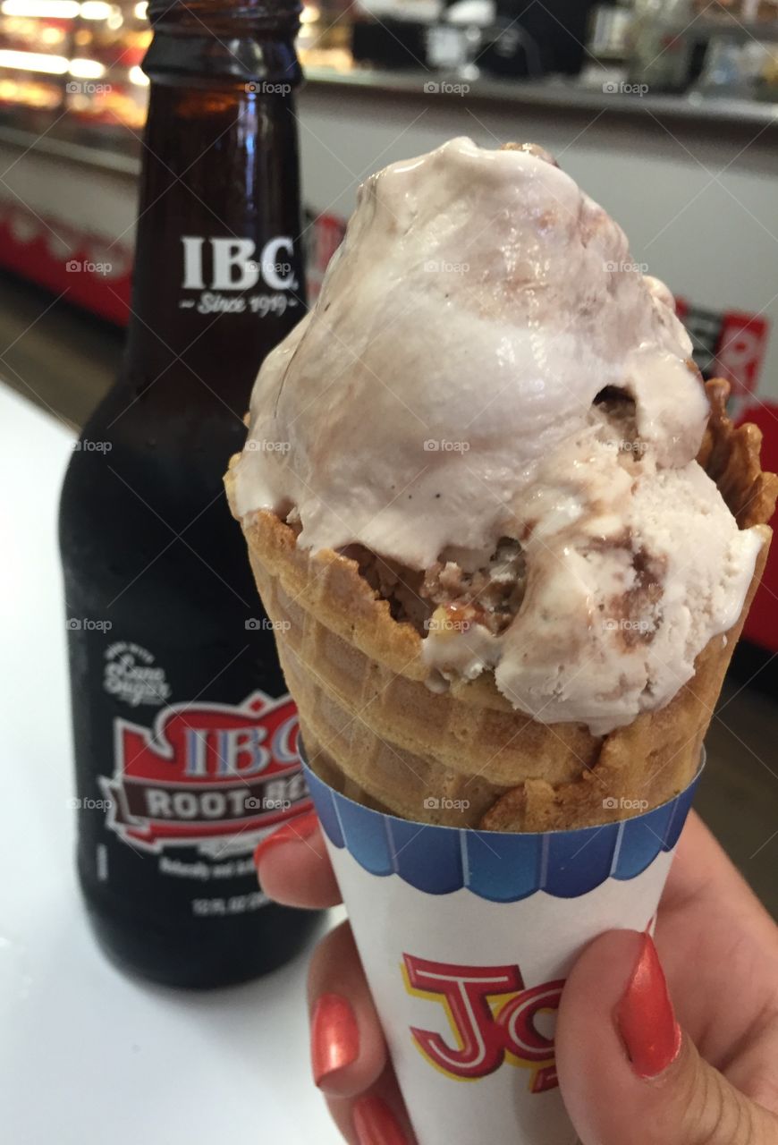 Ice cream cone and root beer in a bottle 