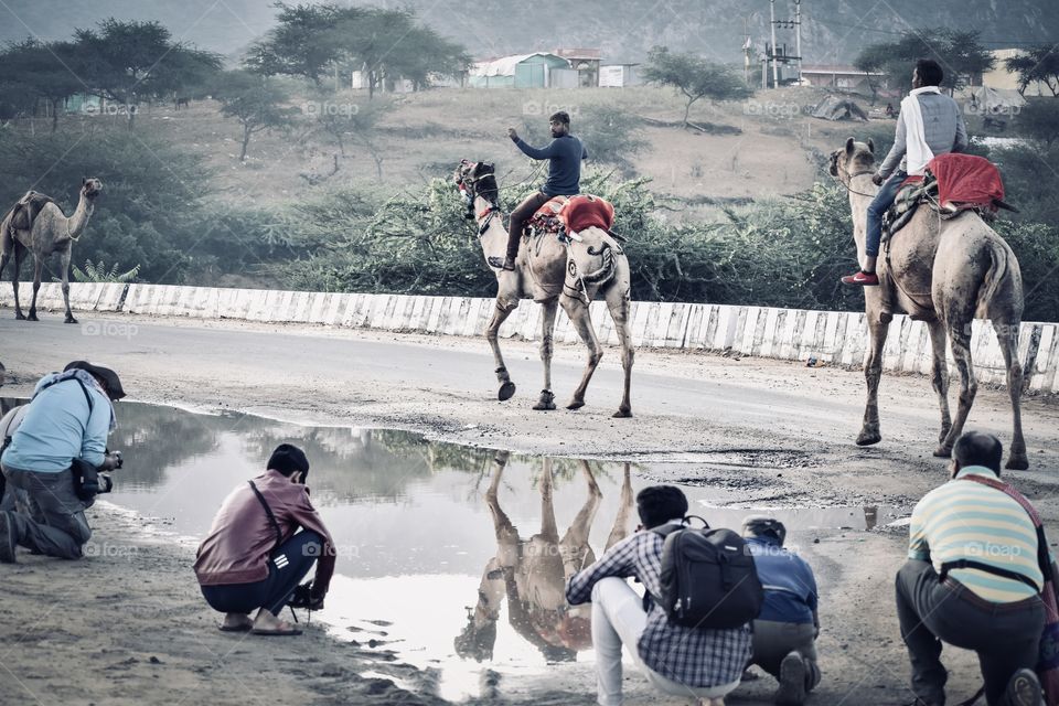 Many photographers click the picture ( reflections)