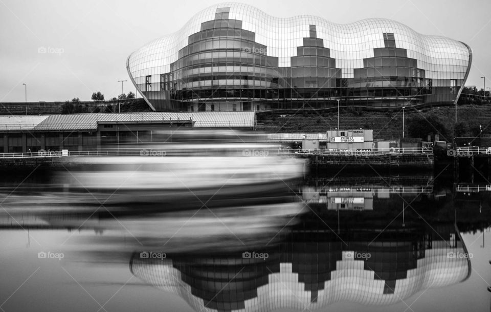 Time lapsed on the water. Time lapsed boat passing a building 