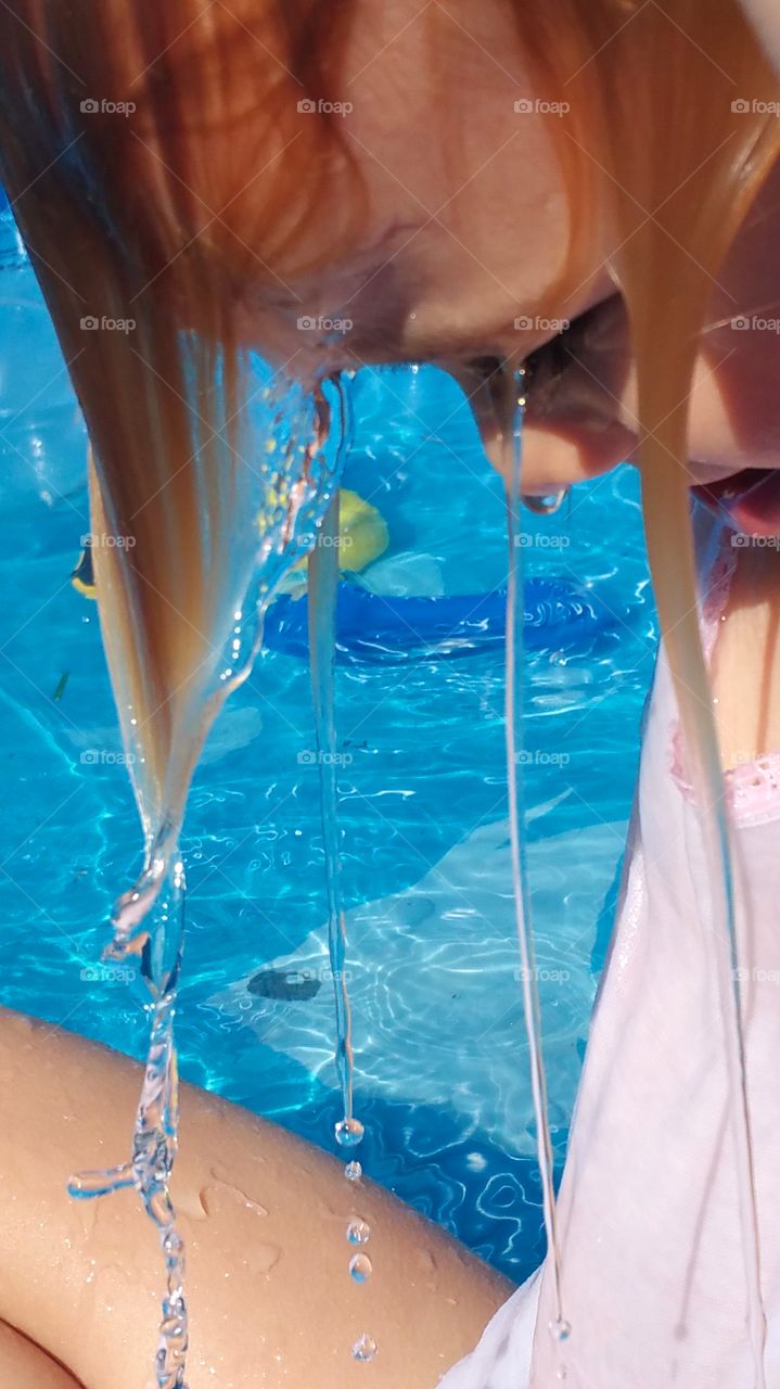 Summer time fun..This is probably my favorite summer picture catching actual droplets of water. My granddaughter Cali cooling off in the pool..