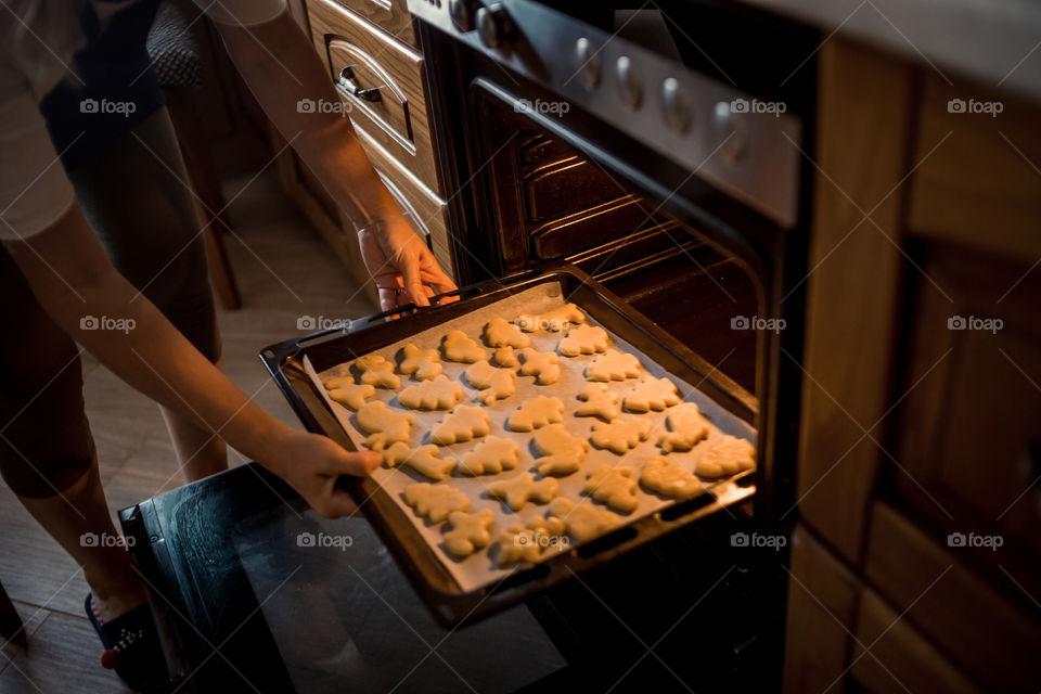 Little sisters cooking the biscuits 