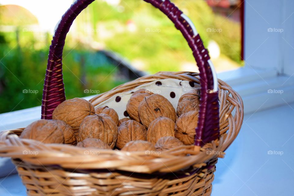 Nuts basket on the window