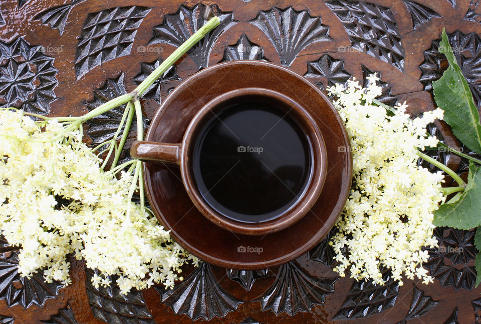 Coffee cup on a wood-carved table 2