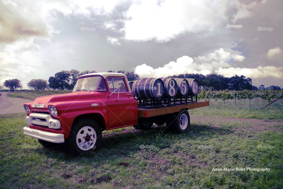 Texas Wine Country Landscape with Red Truck and Storm Clouds - Fredericksburg, Texas