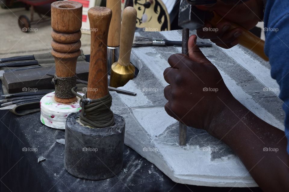 Man carving on the stone