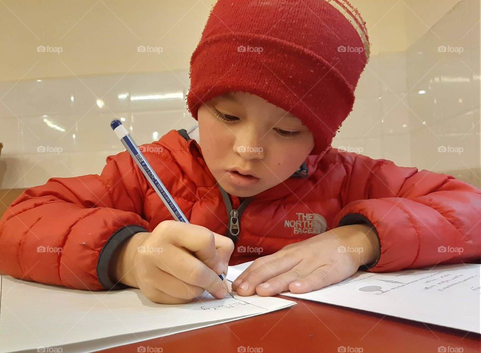 A little monk tries to answer questions to that he got in a exam