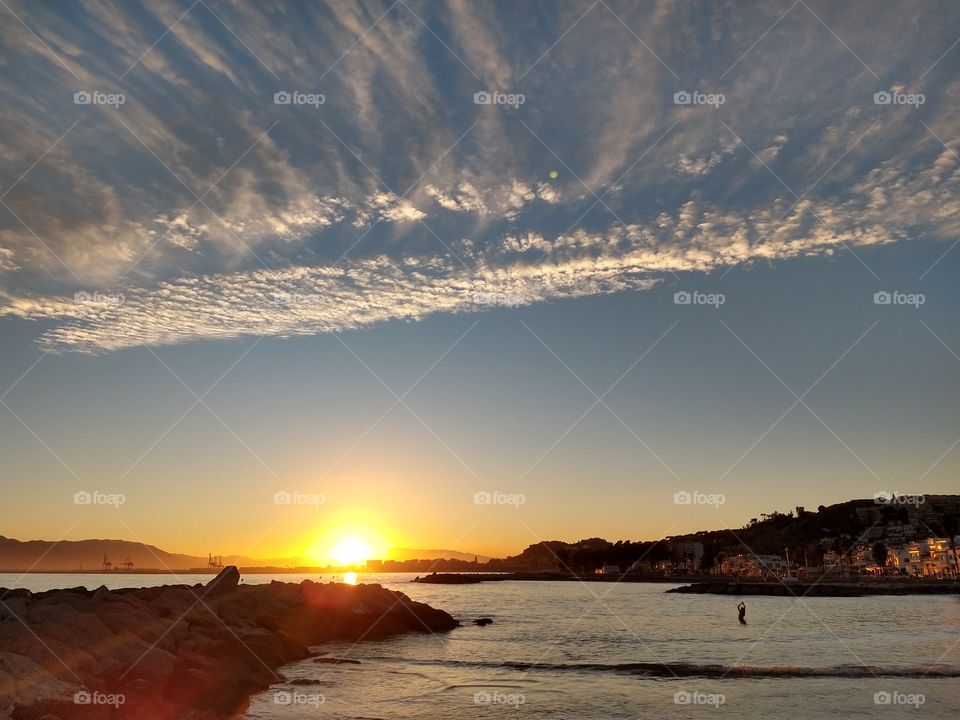Evening bath and relaxation in the sea while watching the sunset.