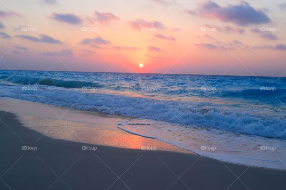 Surf at beach during sunset