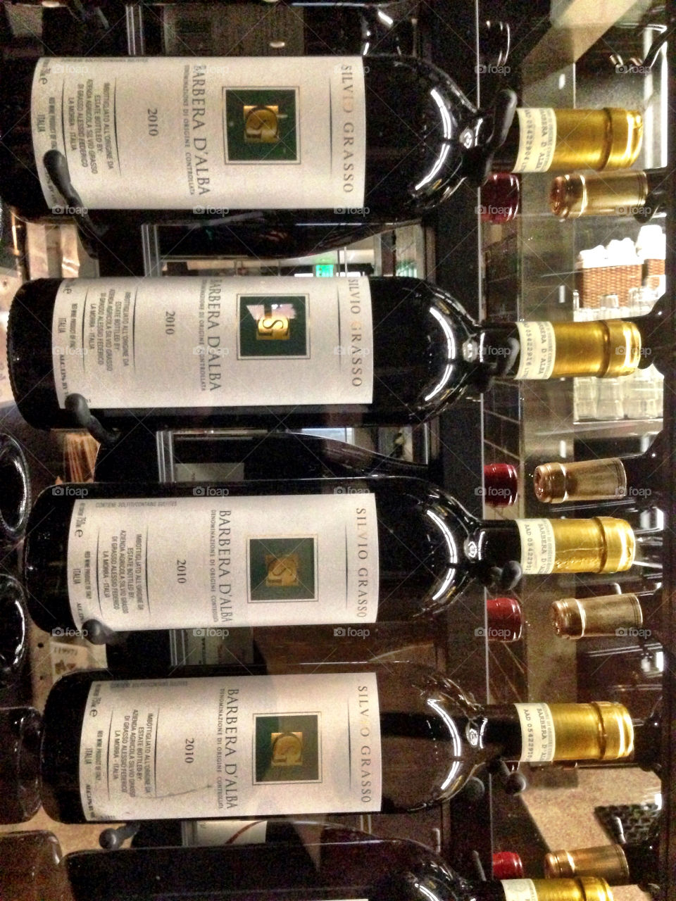 Red wine bottles on a rack in restaurant