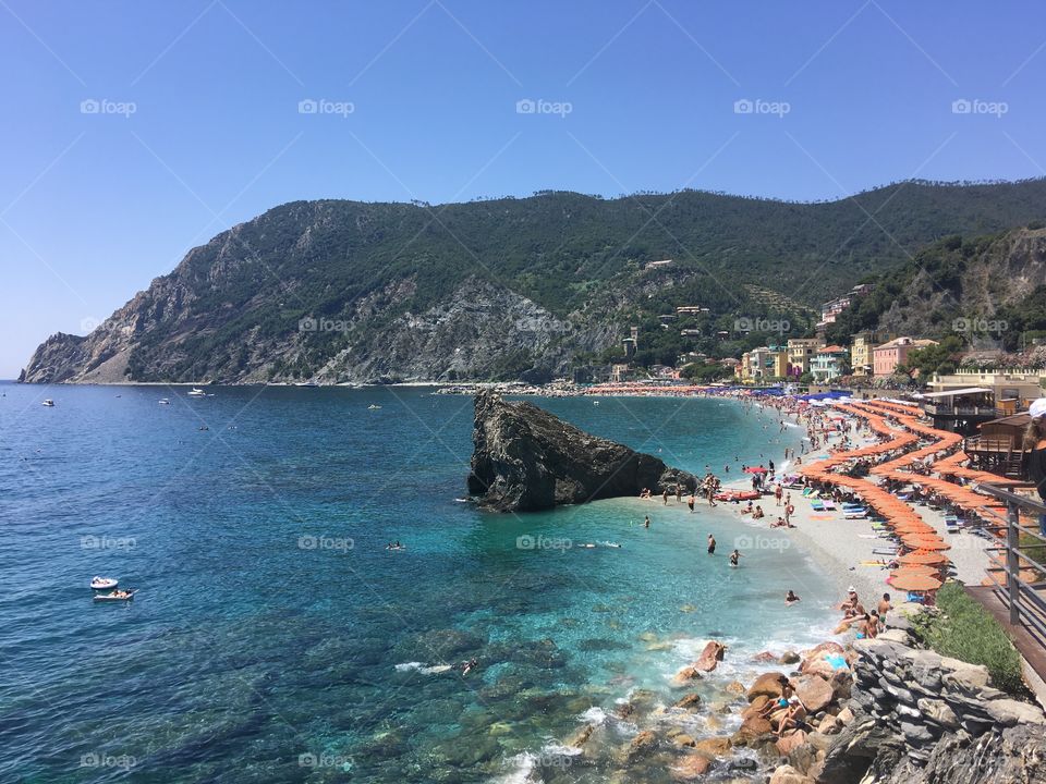 Beautiful scenery of Monterosso al mare from our last trip. Deep blue water and white sand. Waves crashing the shore 