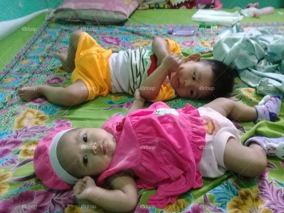 two baby in bed