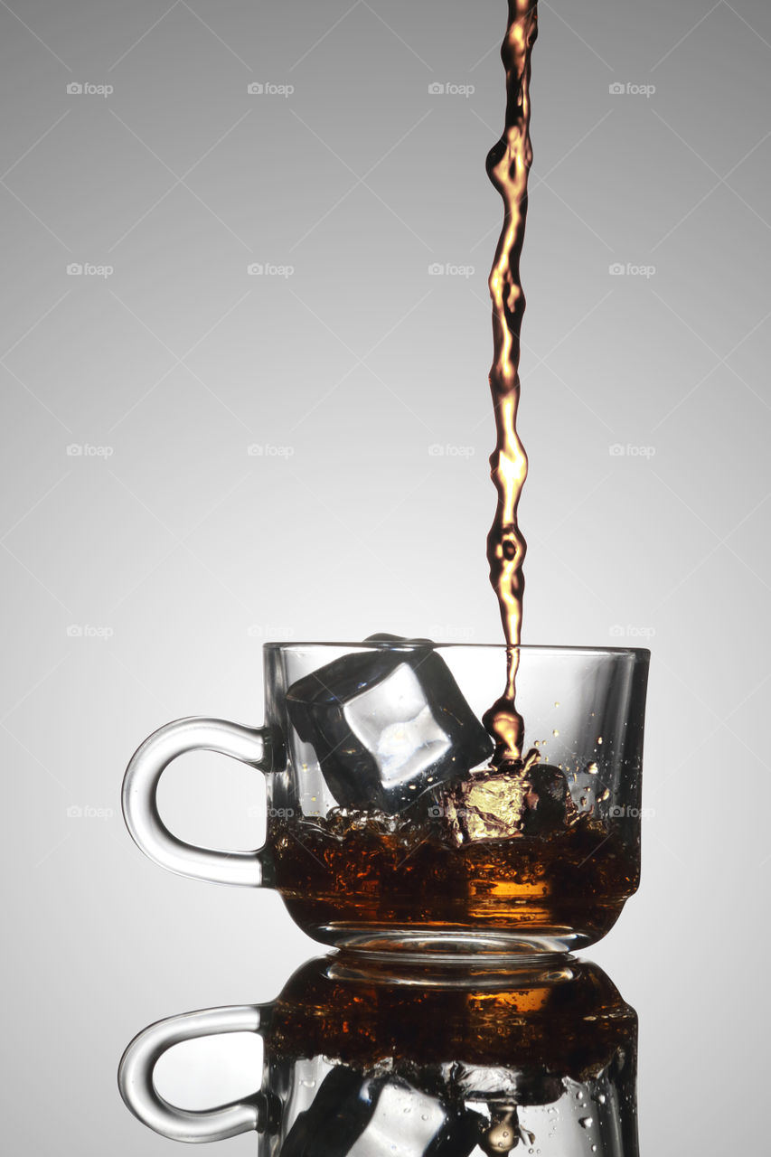 Ice Tea poured into a glass of mug