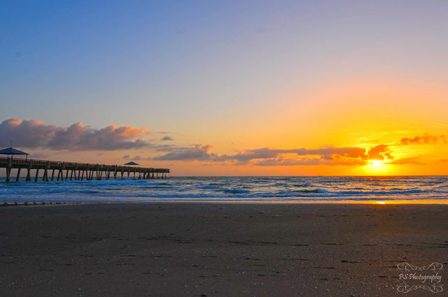 sunrise beside pier