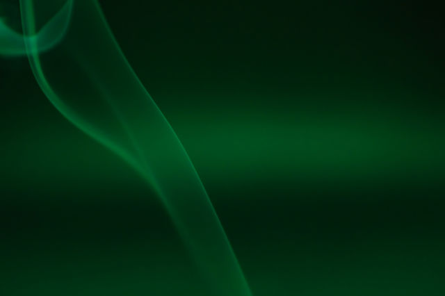 Smoke scented candles on a black background
