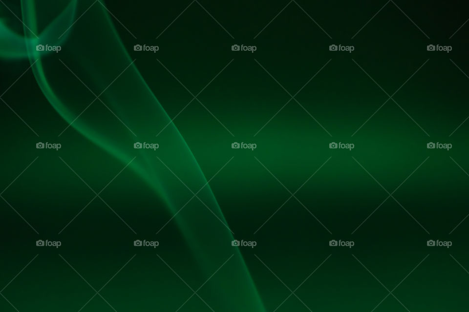 Smoke scented candles on a black background