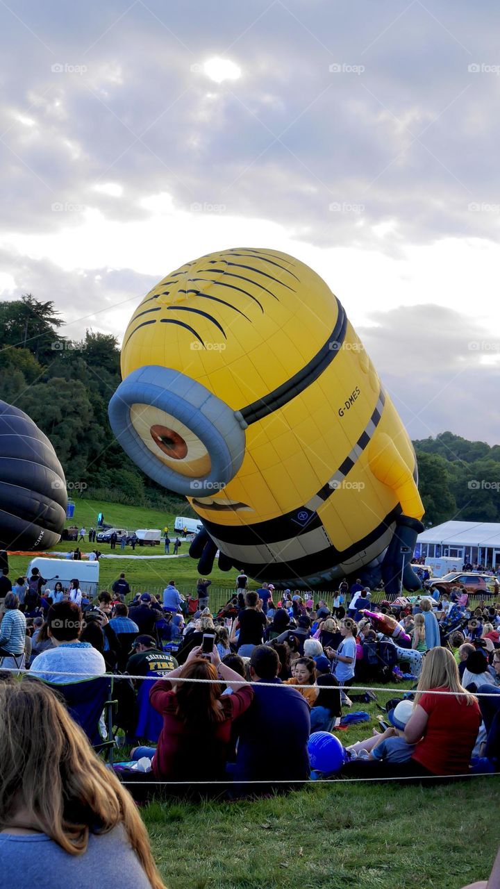 Crowd on hot balloon festival watching minion Stuart hot balloon 