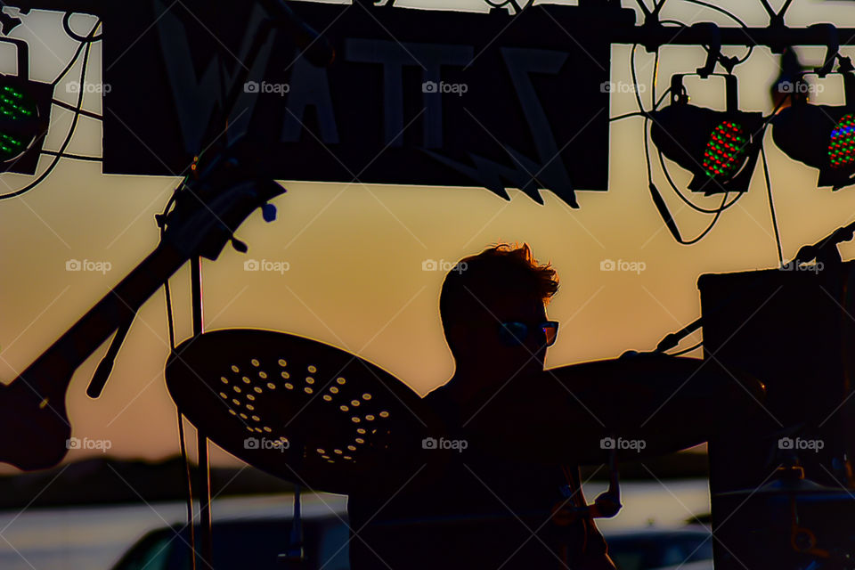 Sun going down on the drummer