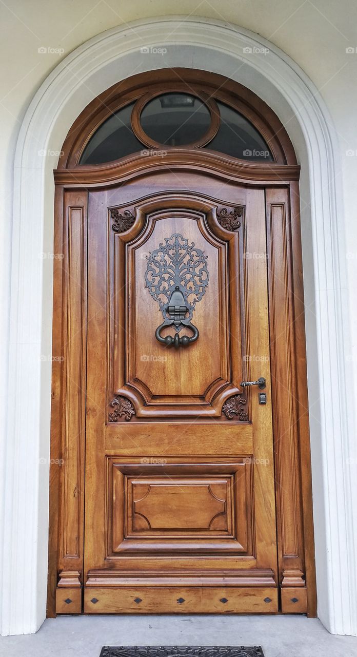 Wooden door with doorknocker