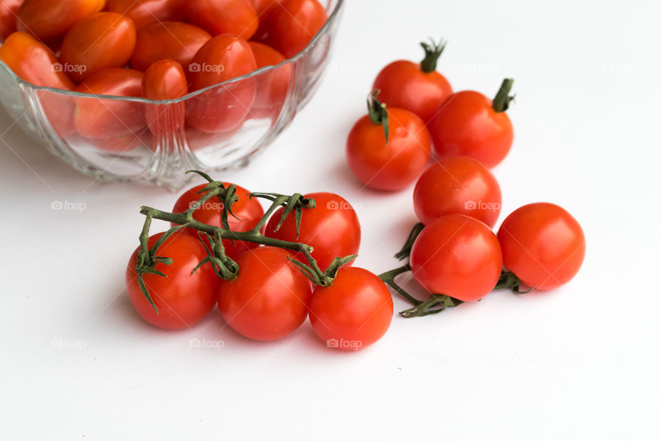 Red tomatoes in different shapes, round and ellipse 