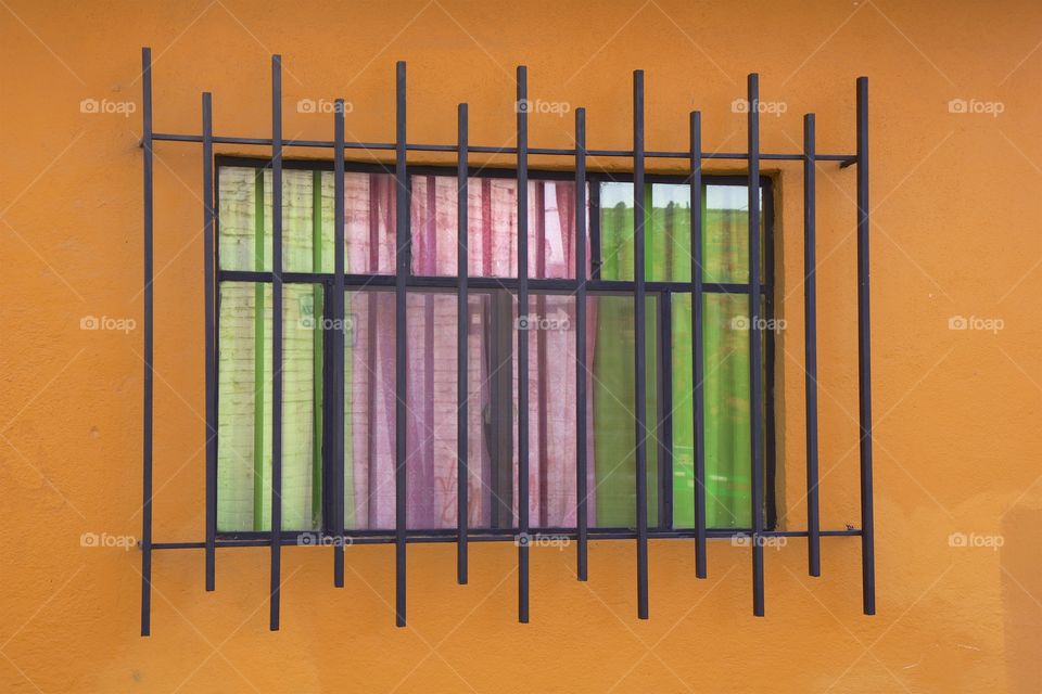 A multicolored image of an exterior and window of a dwelling in San Miguel de Allende, Mexico