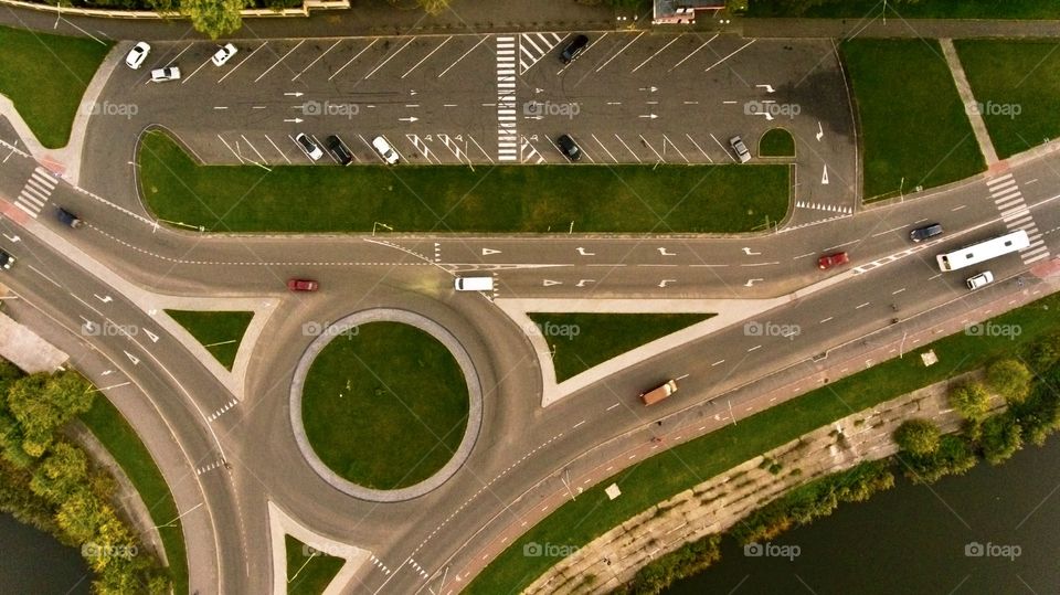 Parking and round road with cars, view from above 