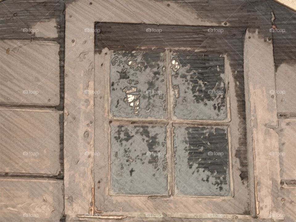 Window on abandoned boathouse