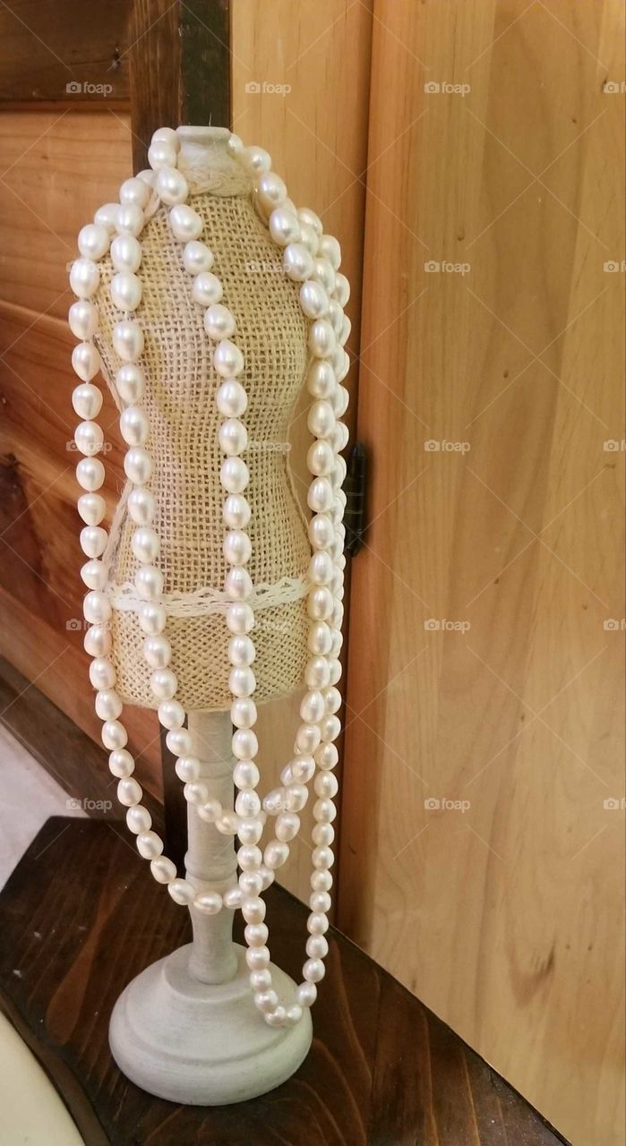 Long Strand of Freshwater Pearls Displayed on Miniature Dress Mannequin, jewelry, cultured