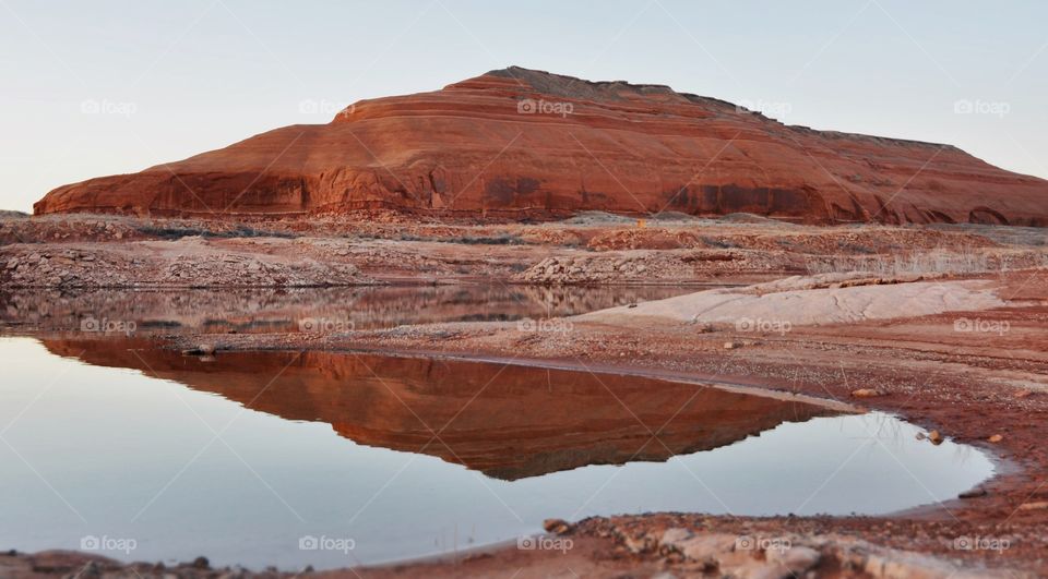 Sunset on beautiful Lake Powell on a warm spring evening. Reflections in the lake create a peaceful vibe. Simple.