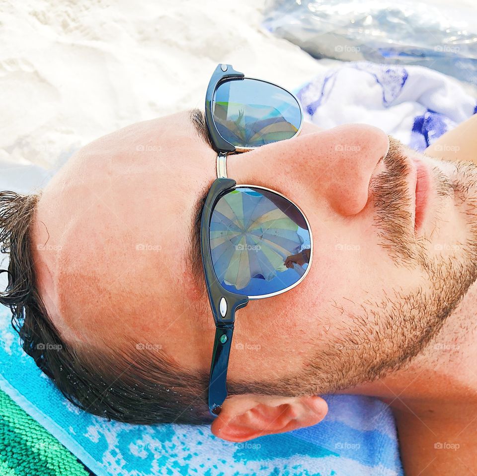 Beaches, umbrellas, sunglasses, reflections