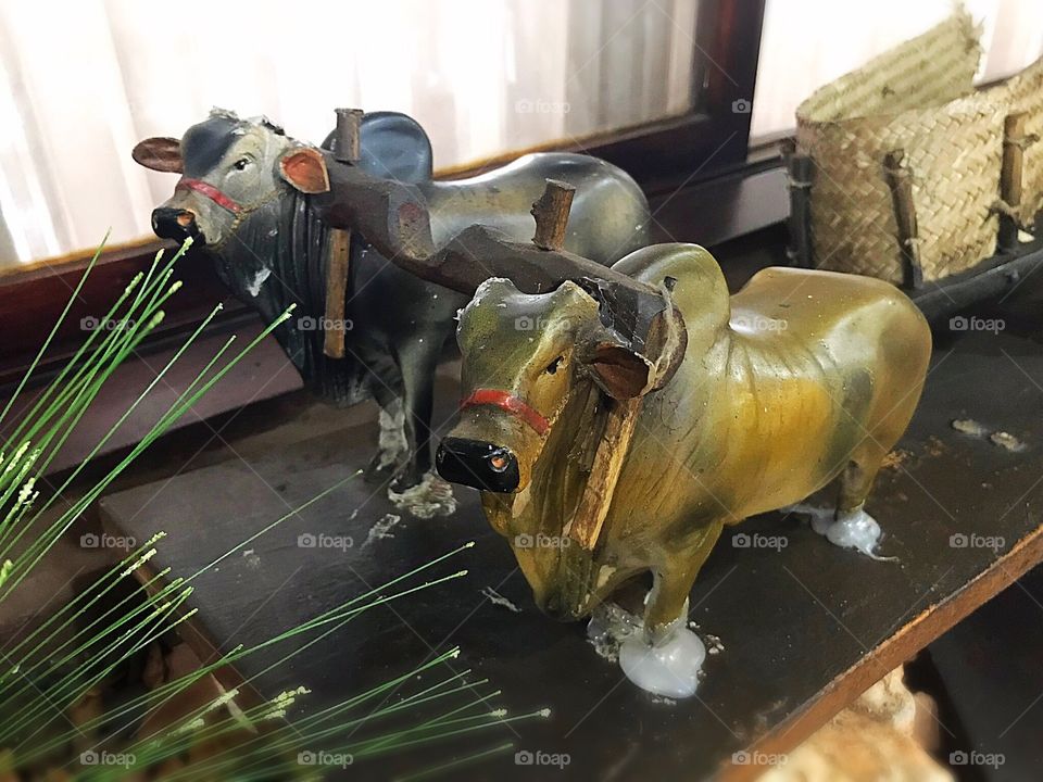 Carving of ox carts pulling cart