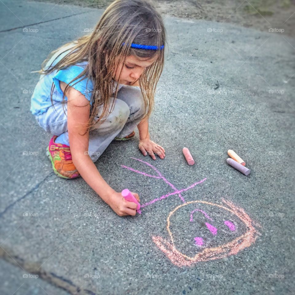  Young chalk artist. Enjoying a spring evening