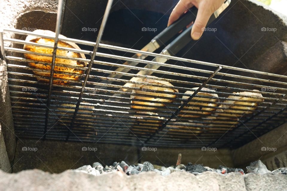 barbecue grill with bruschetta being prepared