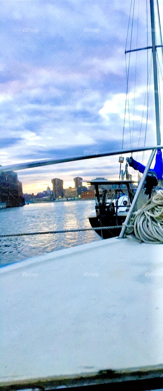 The East River at Newtown Creek in Long Island City, Queens, NY seen from aboard our sailboat, the “Salvation” on a late afternoon in the Fall of 2021 just as the twilight hour approaches. Hypnotic Productions
