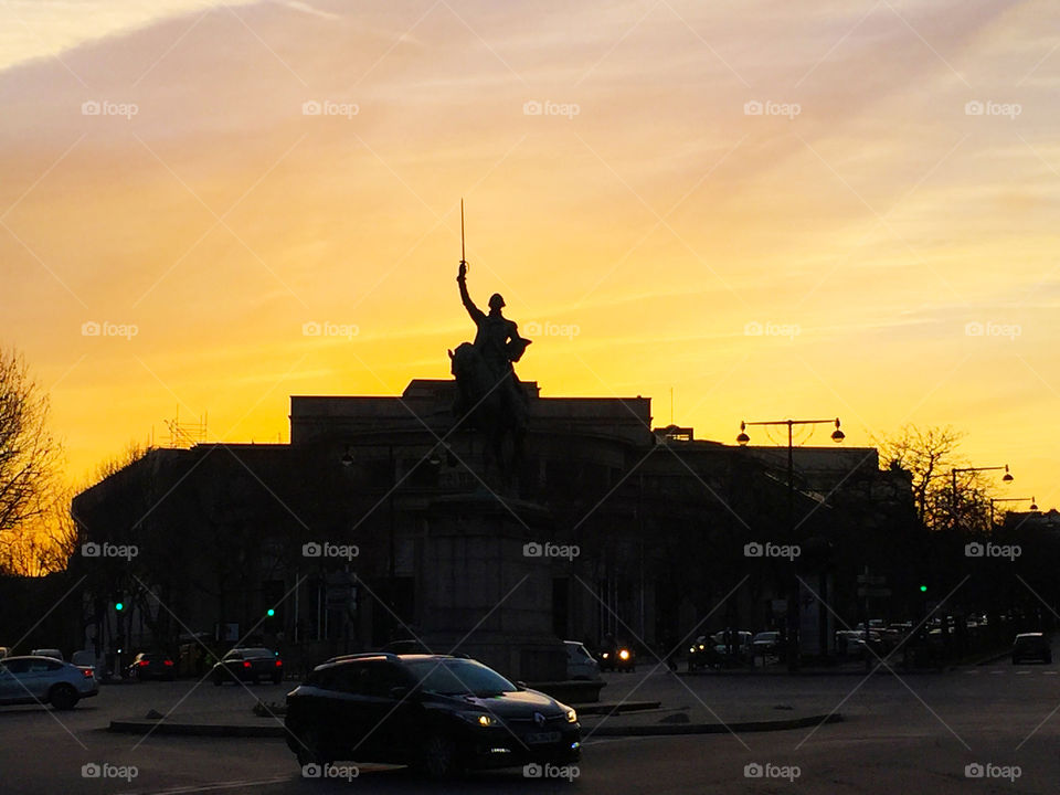 A famous statue in the middle of the street at sunset,Paris,France