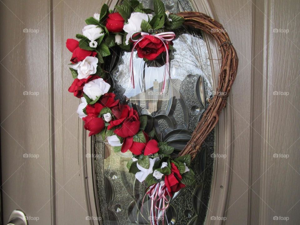 A valentine wreath for the front door, featuring flesh and bones