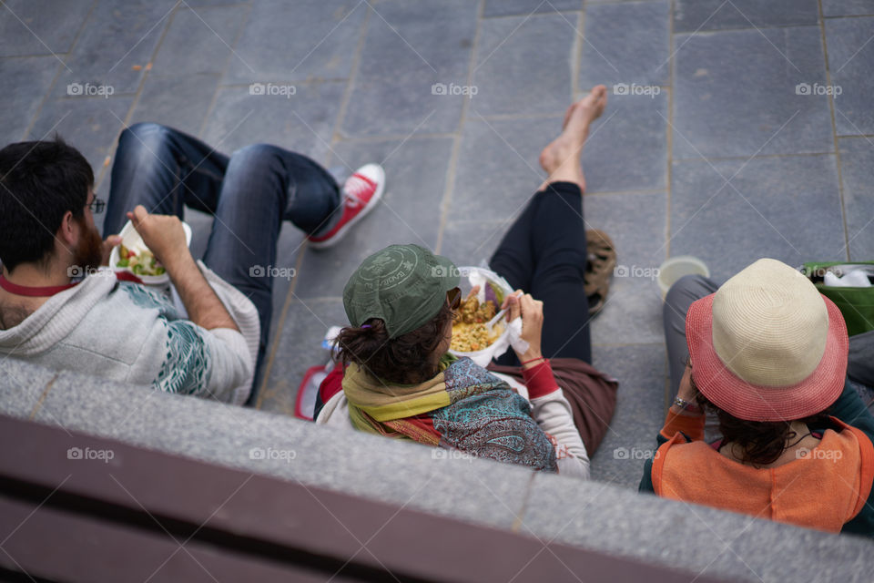 Resting and eating in the street